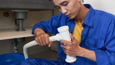 plumber assembling pipe