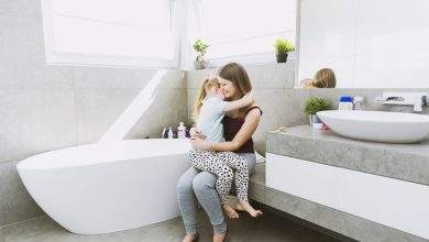 mother hugging daughter bathroom 23 2147807923