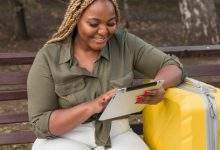 happy woman looking through her tablet 23 2148677860