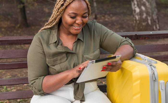 happy woman looking through her tablet 23 2148677860