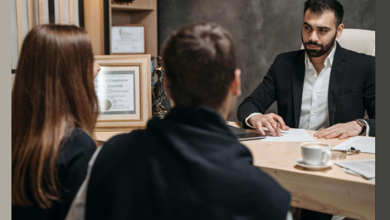 Specialized Attorney consulting with clients at an injury law firm after a serious accident.