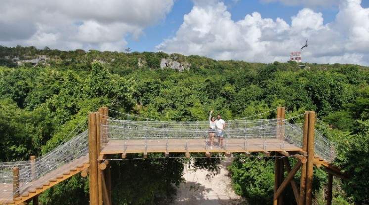 Swimming in turquoise waters at the best cenote in Dominican Republic