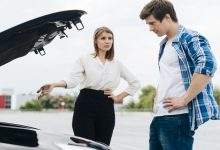 man woman working car