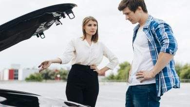 man woman working car